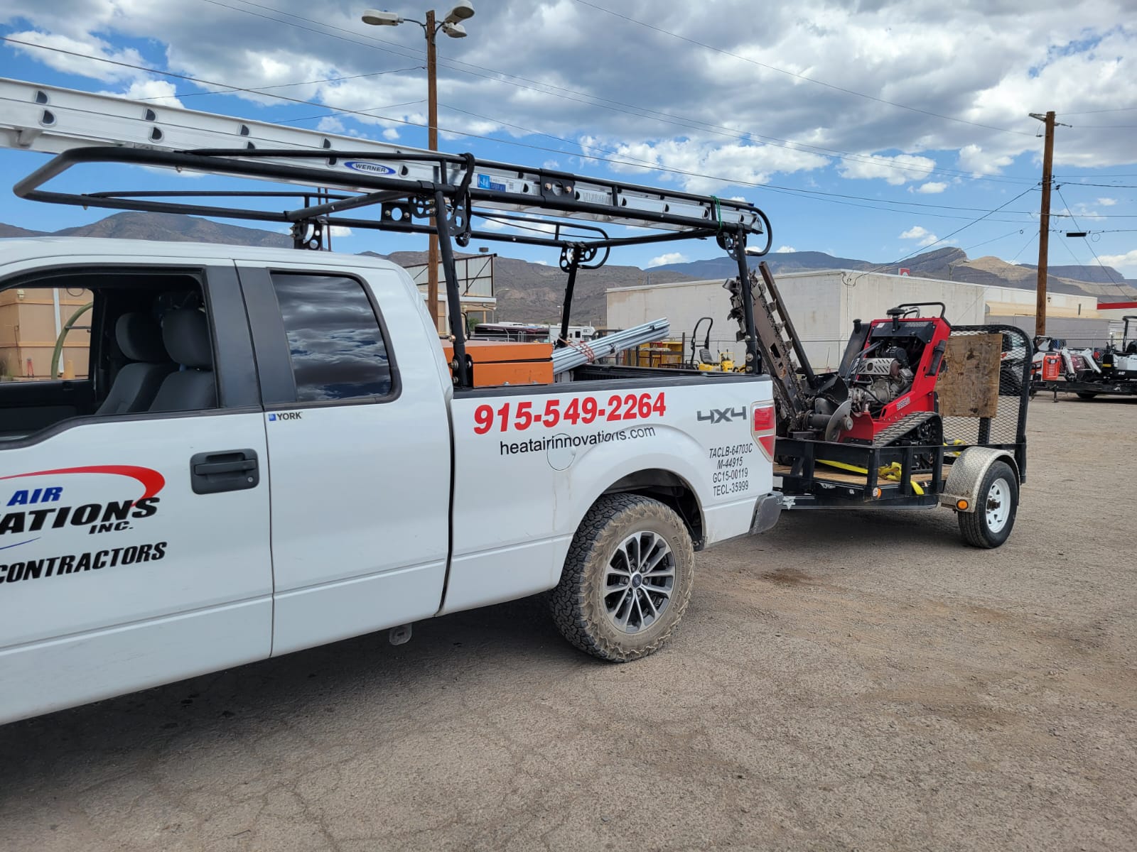 Excavator and service truck on job site